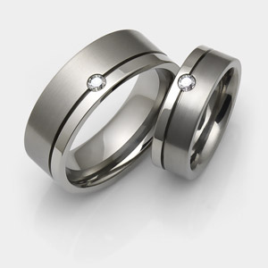 Titanium wedding rings with diamonds and offset groove