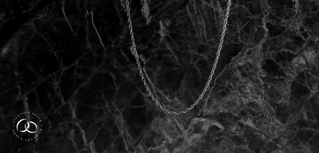 Titanium necklace with a black background