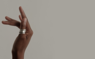 Titanium rings on someones thumb