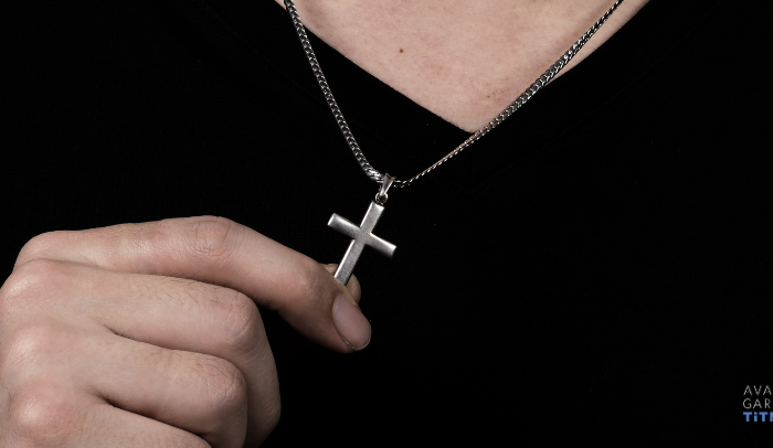 man wearing a titanium cross hypoallergenic jewelry