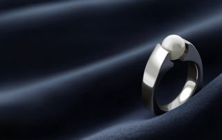 Titanium Ring With Tension Set Pearl
