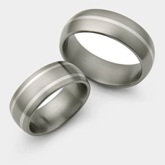 Titanium wedding ring set with thin inlays.
