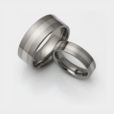 Titanium wedding ring set with thin inlays.